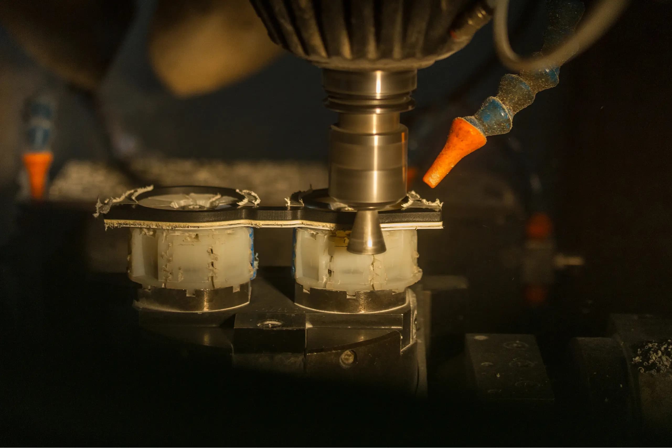 Machinery crafting colorful eyewear frames.
